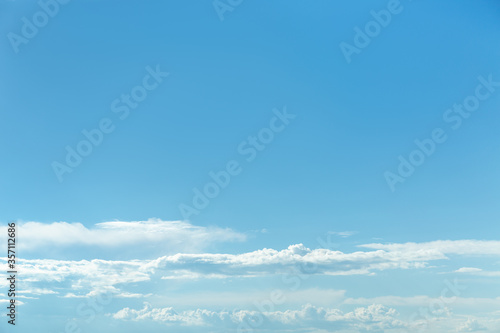 Blue sky background with white clouds.  © Kot63