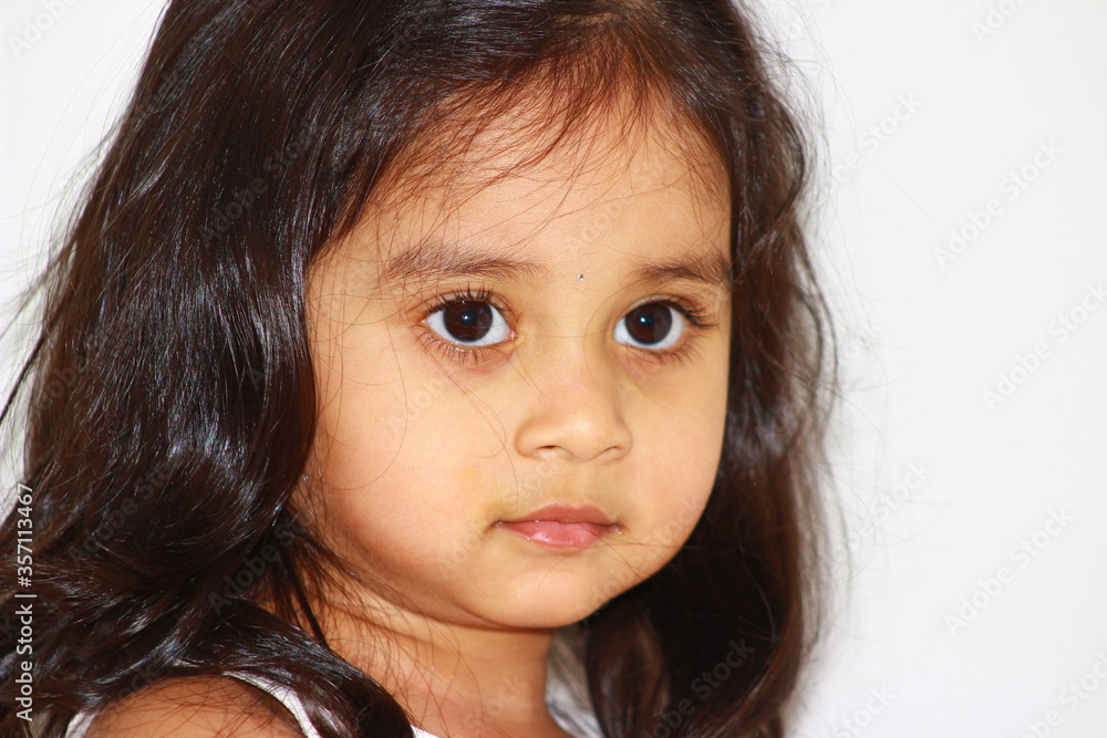 close up of multiple cute expressions and emotions of a toddler girl. close up of multiple cute expressions and emotions of a toddler girl.