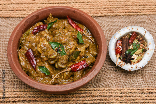Chettinad chicken curry is a hot and spicy dish Tamil Nadu, South India. Gravy prepared from roast and ground Indian spices,coconut or garam masala for meat / non-vegetarian recipe/ cuisine.