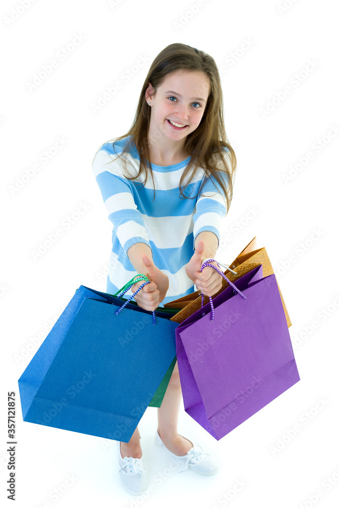 Little girl with multi-colored bags in their hands. Little girl with multi-colored bags in their hands.
