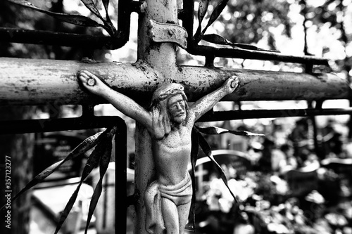 Abandoned cross on the cemetery. photo