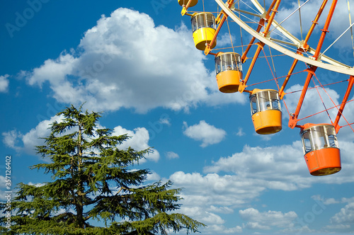 Ferris wheel on a blue sky