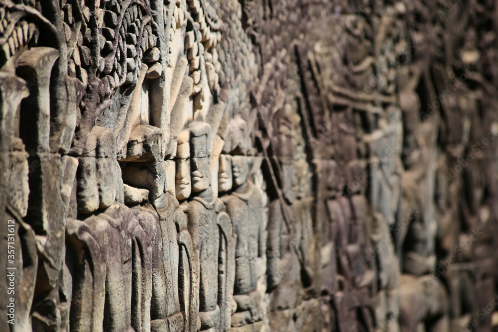 Details of ancient stone carvings in Angkor Wat's Bayon Temple Details of ancient stone carvings in Angkor Wat's Bayon Temple