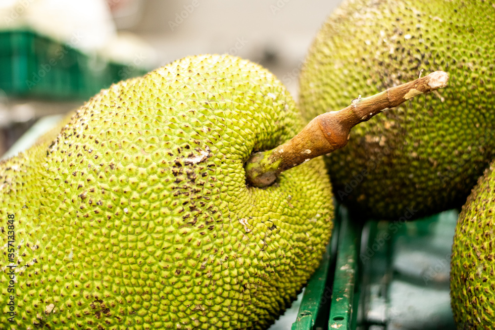 Green Jackfruits are in basket for sale in the supermarket. Healthy concept. Green Jackfruits are in basket for sale in the supermarket. Healthy concept.
