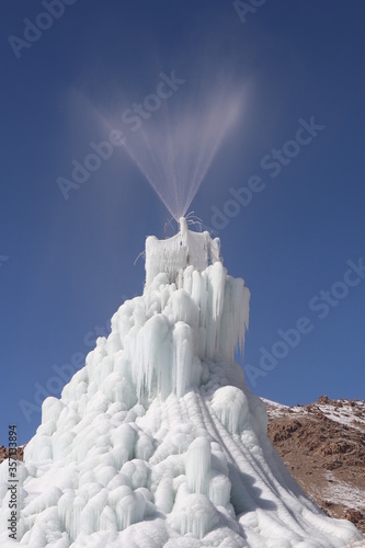 Ice Stupa is a form of glacier grafting technique that creates artificial glaciers, used for storing winter water in the form of conical shaped ice heaps. During summer, when water is scarce, the Ice. photo