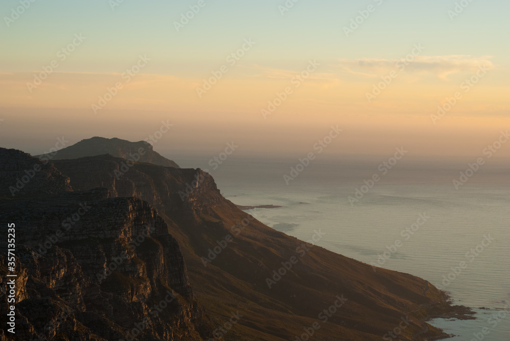 Sunset over the Table Mountain and ocean in Cape Town South Africa