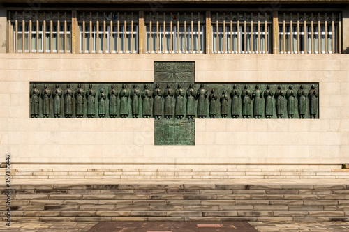 Twenty-Six Martyrs Monument. Christianity Memorial in Nagasaki, Japan. Inscription says: Praise the Lord, all you nations. photo