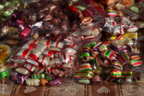 Assorted colorful candies on the table at the candy shop © snowyns