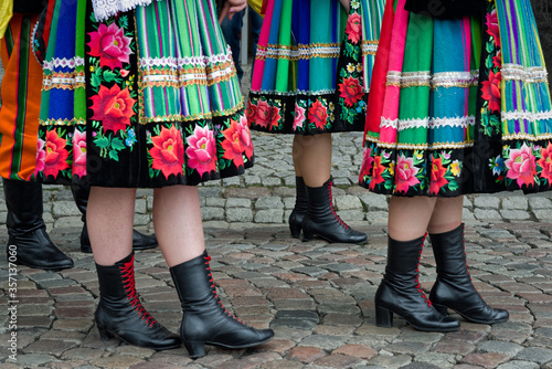 Women and young girls wearing regional folk costumes from Lowicz region in Poland during annual Corpus Christi procession
