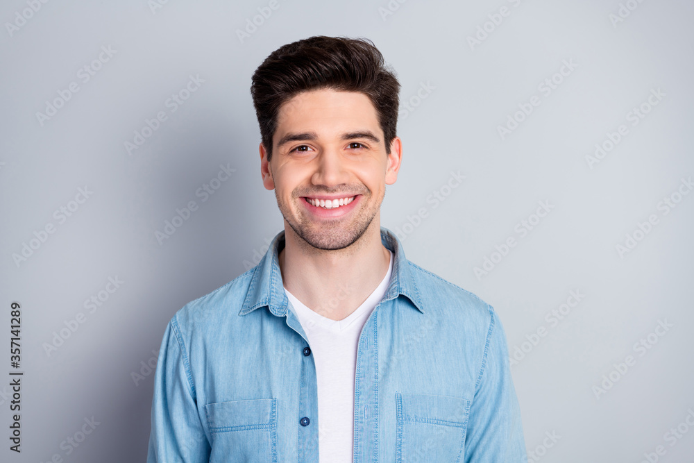 Closeup photo of macho attractive guy perfect appearance neat hairdo bristle smiling toothy wear casual blue denim shirt isolated grey color background Closeup photo of macho attractive guy perfect appearance neat hairdo bristle smiling toothy wear casual blue denim shirt isolated grey color background