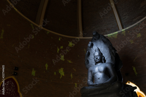 Phra Nakhon, Bangkok, Thailand - January 25, 2020: Seven-Headed Naga of Buddha Image, was built in Lopburi period, was a Bayon Style, is inside the pagoda of Wat Ratchabophit. photo