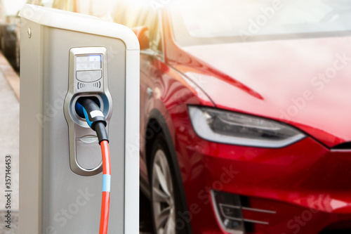 Charging station on the background of an electric car. 