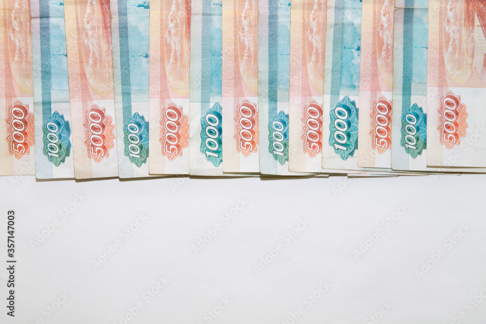 Copy space with Russian money banknotes rows of five thousand and one thousand rubles on white backround Copy space with Russian money banknotes rows of five thousand and one thousand rubles on white backround