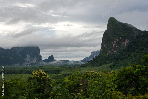 The scenery of the fog over the mountain in sunset time at Krabi province, Thailand.