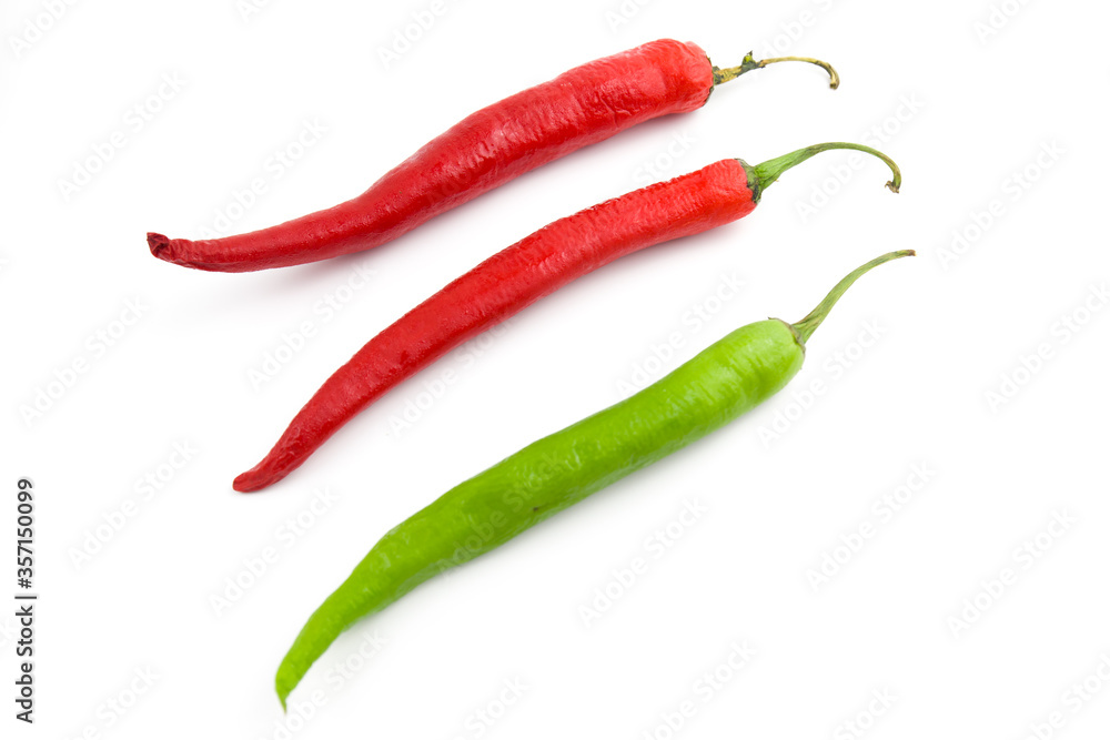 Fresh green chili pepper and dry red chili pepper. Isolated on white background.