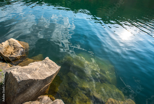 Stone quarry with lake. deep water. A place for swimming and relaxation.