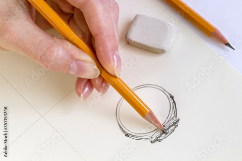  Drawing Jewelry Design. Drawing sketch jewelry on paper . Design Studio. Creativity Ideas. photo