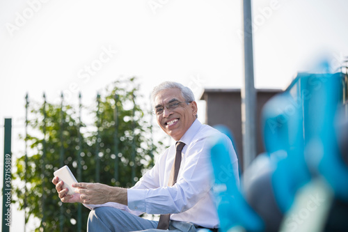 Photography Senior businessman using digital tablet