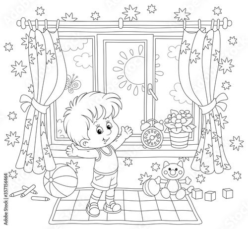 Little boy doing gymnastic exercises on a carpet in his nursery room with toys on a sunny morning, black and white outline vector cartoon illustration for a coloring book page