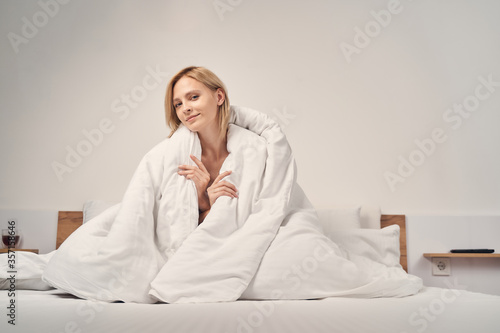 Fotografía Relaxed calm lady sitting on the bed