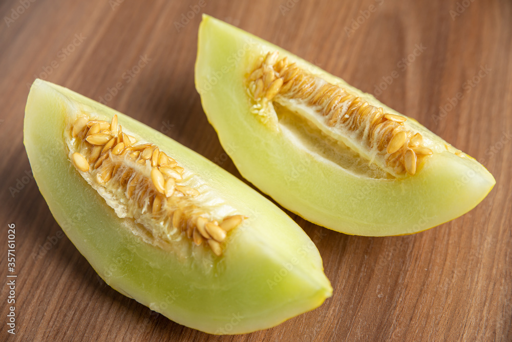Yellow melon on a wooden table Yellow melon on a wooden table