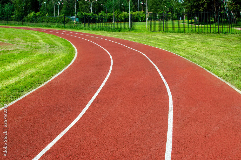 Red rubber running track in a stadium