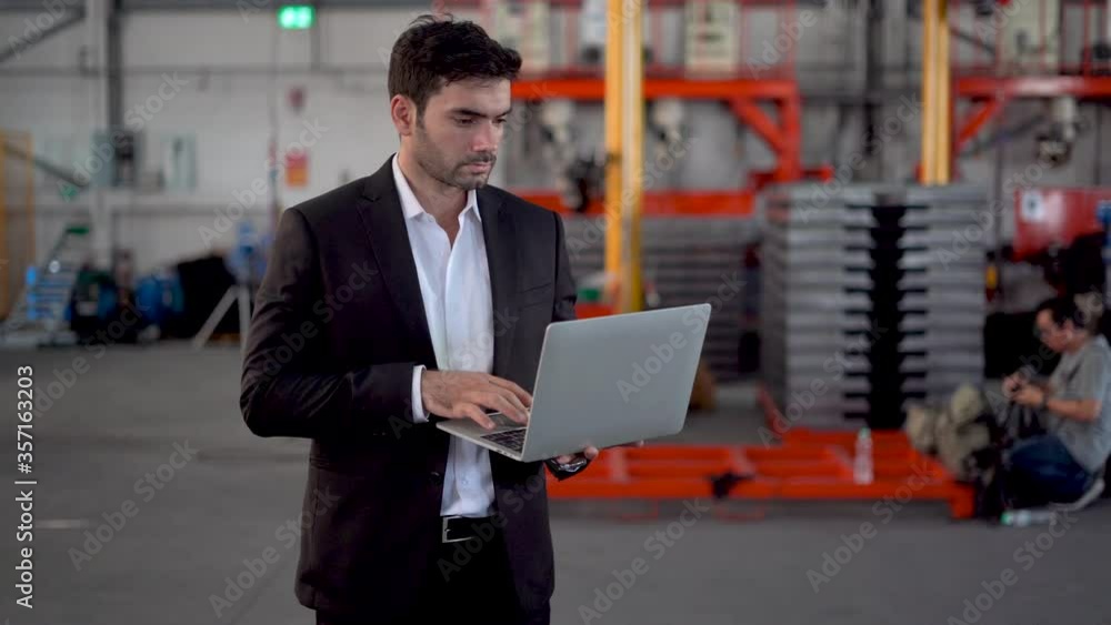 Businessman is Using Tablet PC in Industrial Environment. Businessman is Using Tablet PC in Industrial Environment.