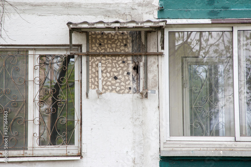 The wall of the house after the removed air conditioner