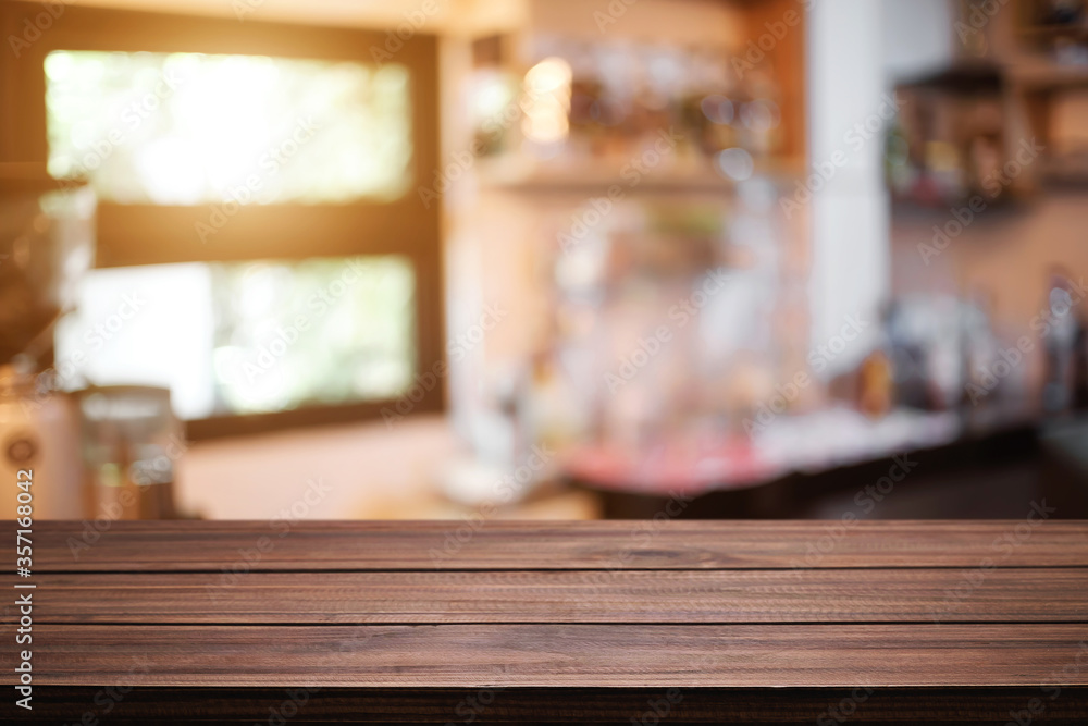 Empty desk space platform over blurred restaurant or coffee shop background for product display montage.