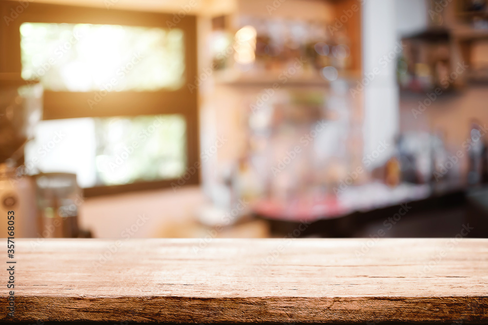 Empty desk space platform over blurred restaurant or coffee shop background for product display montage. Empty desk space platform over blurred restaurant or coffee shop background for product display montage.