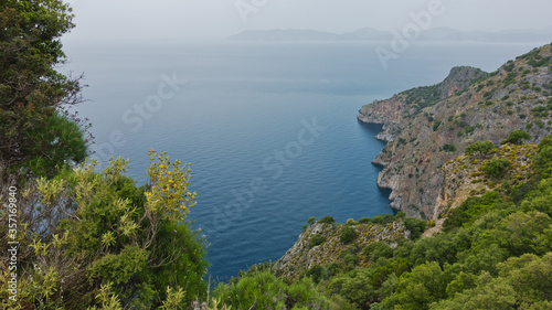 View from a hidder monastery high on a cliffs over mediteranean sea, Lycian way near Kayakoy village and Oludeniz beach, Fethiye, Turkey