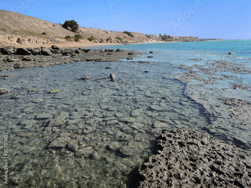 Panoramic view onto coastline of Rishehr Beach. Picture taken in Rishehr, southern suburb of sea port Bushehr located on Persian Gulf, Iran photo