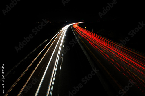 light trails on highway at night, long exposure photo