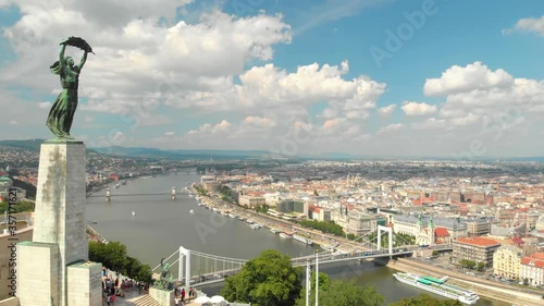 Budapest, Hungary. Drone Aerial View of Liberty Statue and Danube River From Gellert Hill on Sunny Summer Day photo