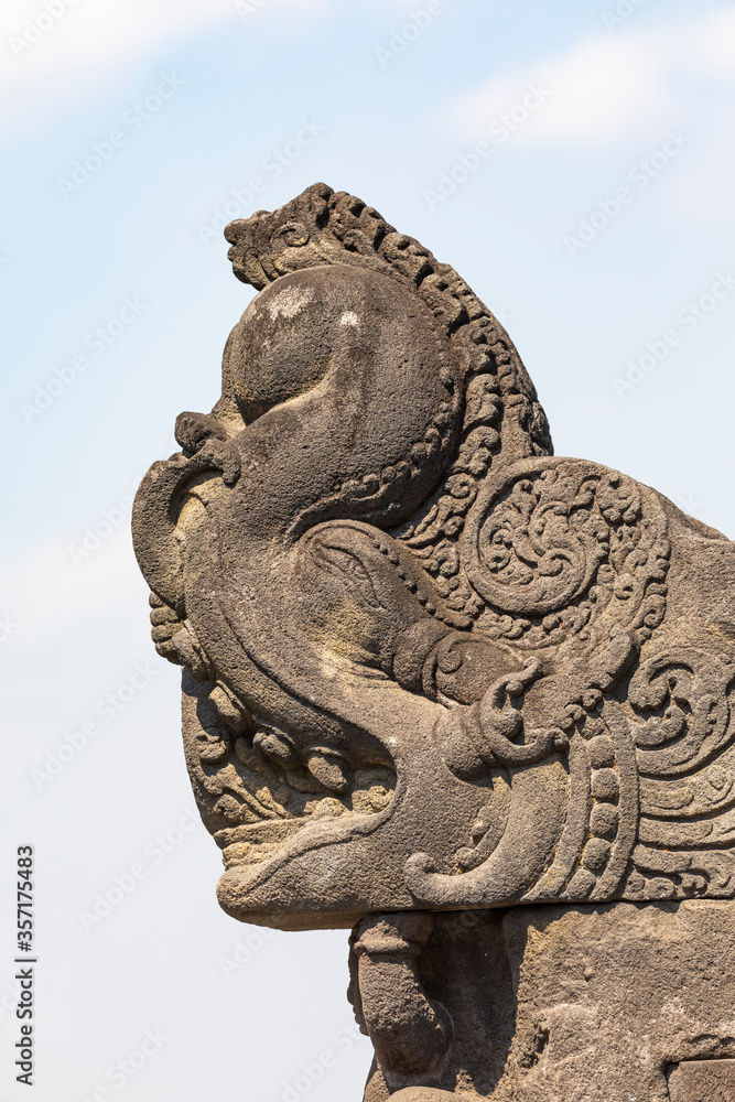 Detail of a gargoyle, called Makara, carved stone water spout, from the Borobudur temple drainage system in Central Java, Indonesia.