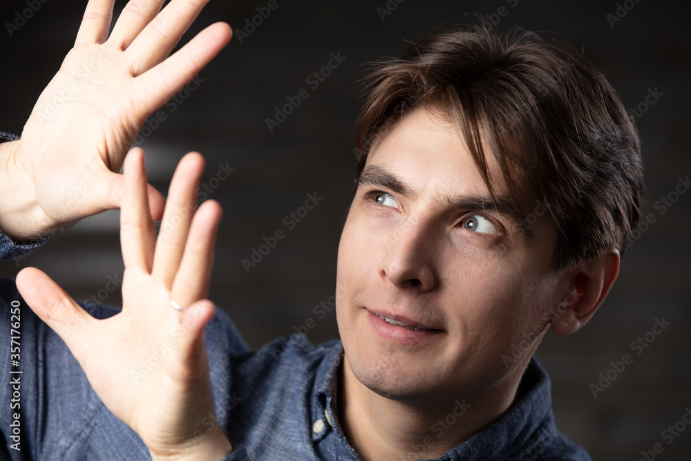 A man shows gestures with his hands. A man shows gestures with his hands.