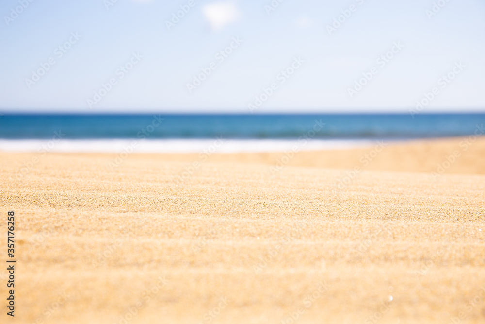 sandy beach near Atlantic ocean against clear blue sky at sunny day in Maspalomas, Gran Canaria sandy beach near Atlantic ocean against clear blue sky at sunny day in Maspalomas, Gran Canaria