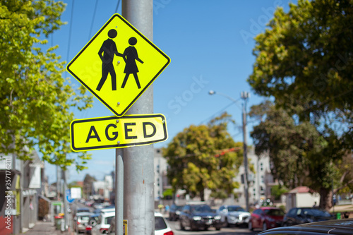 Road sign. Aged. Australia, Melbourne. City street.