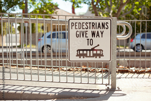 Road sign. Pedestrians give way to tram. Australia, Melbourne.