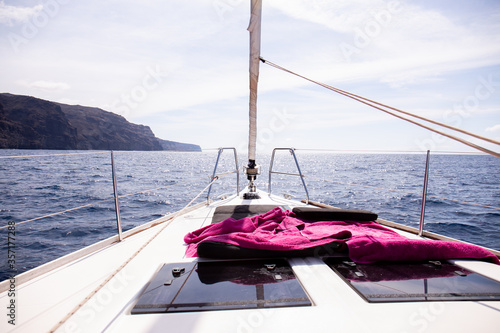 view from yacht at rock in Atlantic ocean and blue sky in Maspalomas, Gran Canaria