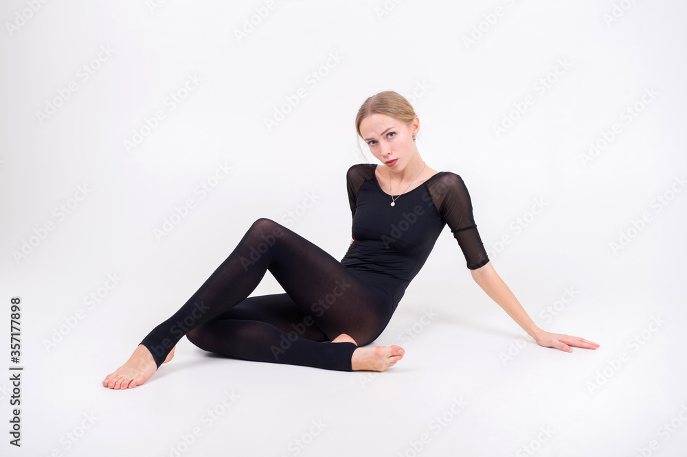 Beautiful flexible girl gymnast over white background Beautiful flexible girl gymnast over white background