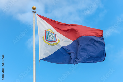 The national flag of Sint Maarten fluttering in the wind, a country within the Kingdom of the Netherlands occupying the southern half of the island of Saint Martin (Dutch part) photo