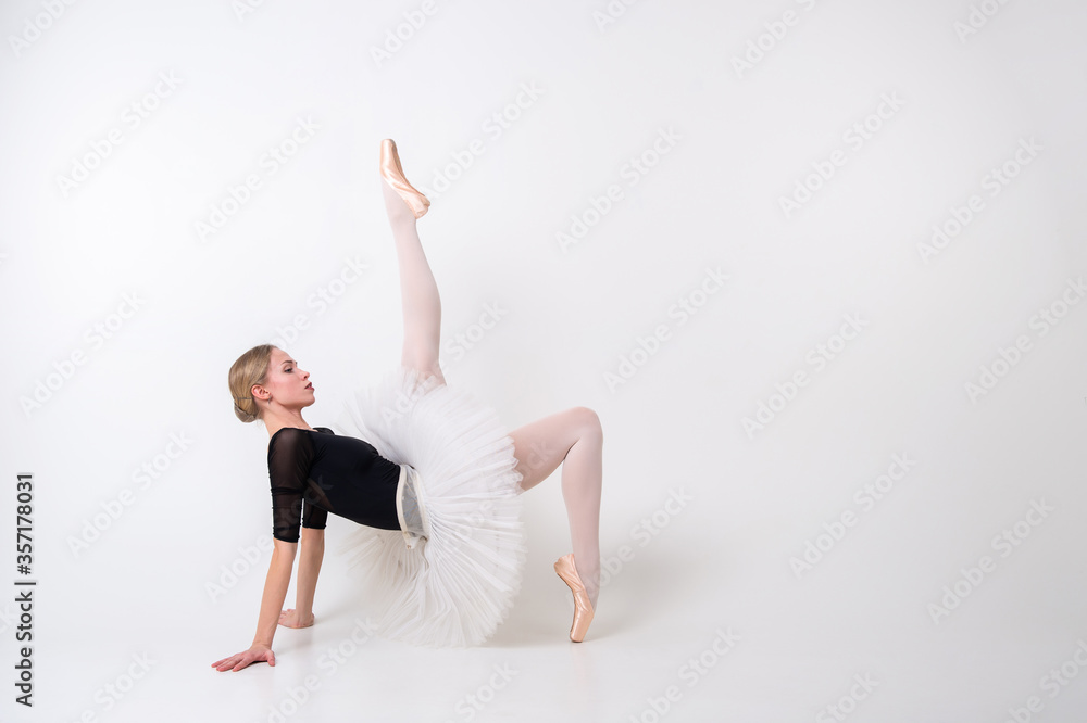 Sightly young beautiful ballerina poses for the camera isolated on white background Sightly young beautiful ballerina poses for the camera isolated on white background