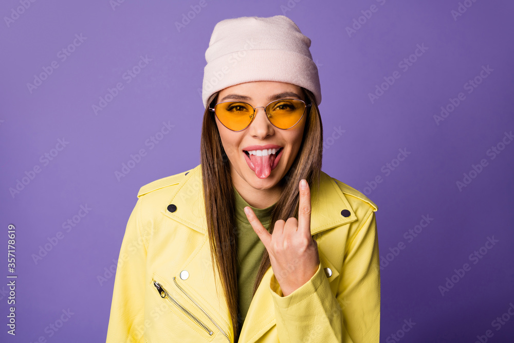Close-up portrait of her she nice attractive cool lovely cheerful cheery girl punk showing horn sign grimacing isolated over bright vivid shine vibrant lilac purple violet color background Close-up portrait of her she nice attractive cool lovely cheerful cheery girl punk showing horn sign grimacing isolated over bright vivid shine vibrant lilac purple violet color background
