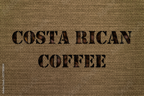Costa Rican coffee varieties text made up of coffee beans on a background of canvas fabric photo