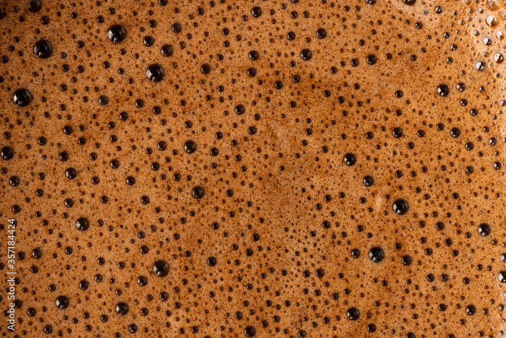 Brown coffee foam with bubles top view Brown coffee foam with bubles top view