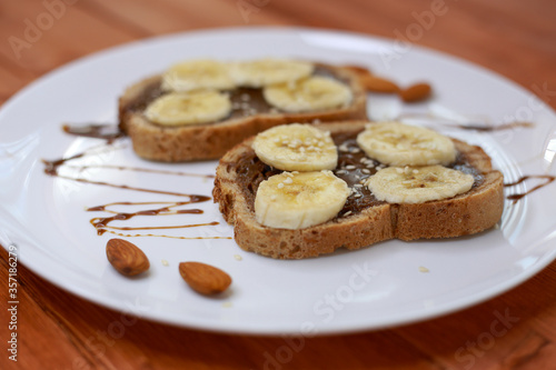 healthy dessert with chocolate paste and bananas