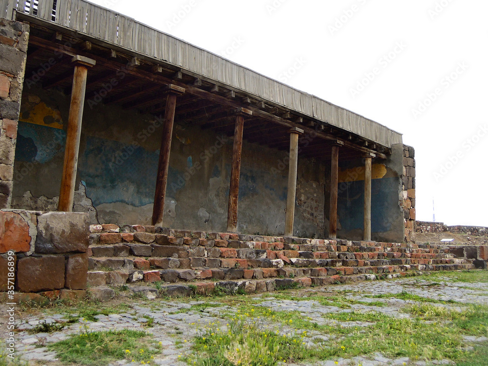 Portico with the columns near the main entrance into the ancient urartian fortress Erebuni, one of the oldest fortifications in the world, founded in 782 BC, Yerevan, Armenia