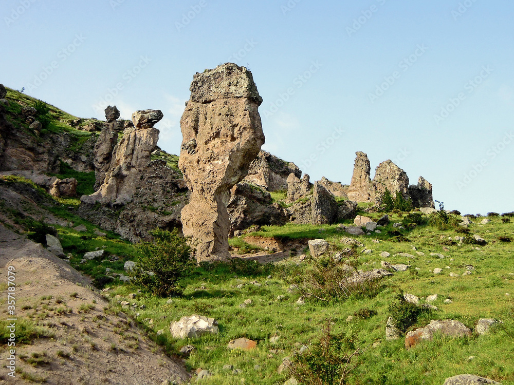 Limestone remnants inside geological park Stone Forest near Goris, Armenia. Park is most attractive nature sight of town. Some of formations used as habitations of ancient dwellers