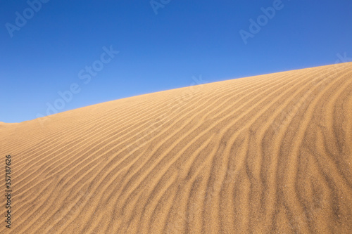 sand dune against clear blue sky in Maspalomas  Gran Canaria
